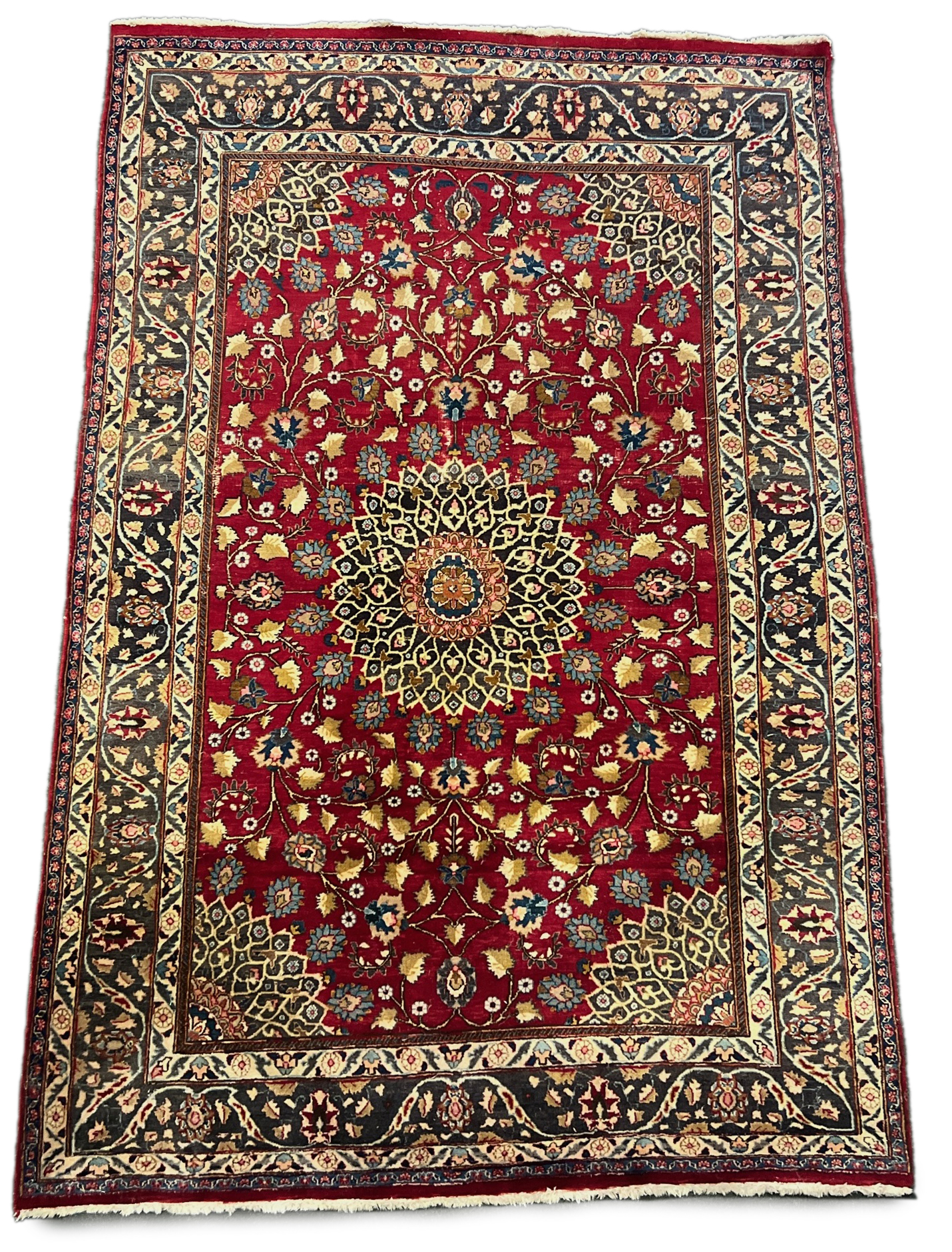 A Tabriz red ground carpet